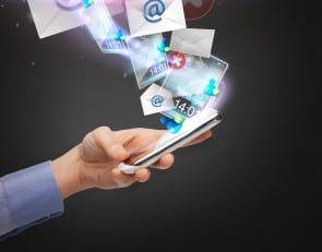 hand holding smartphone with icons
