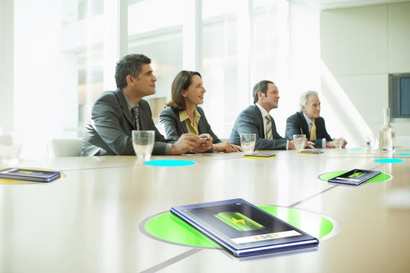 Business people sitting in conference room talking