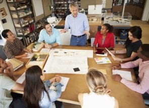 Fotolia_62338509_Subscription_XXL Group Of Architects Sitting Around Table Having Meeting © Monkey Business - Fotolia