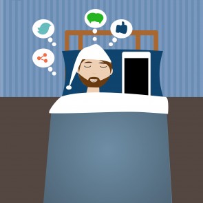 Hipster man in the bed time with smart phone