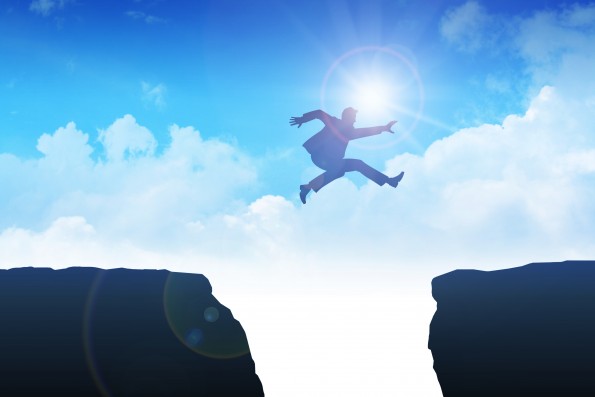 Man jumping over the ravine