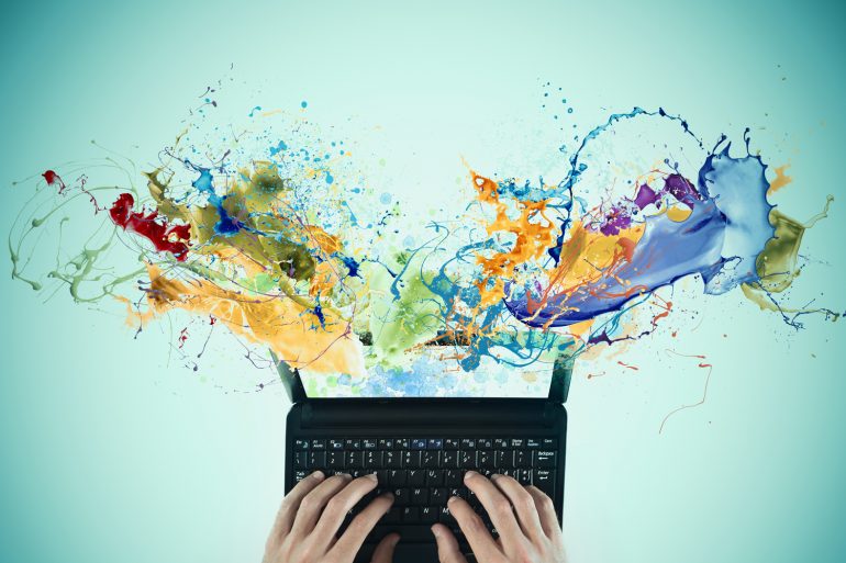 Afbeelding van laptop met verfspatten vanaf het beeldscherm